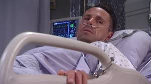 Julian handcuffed to bed